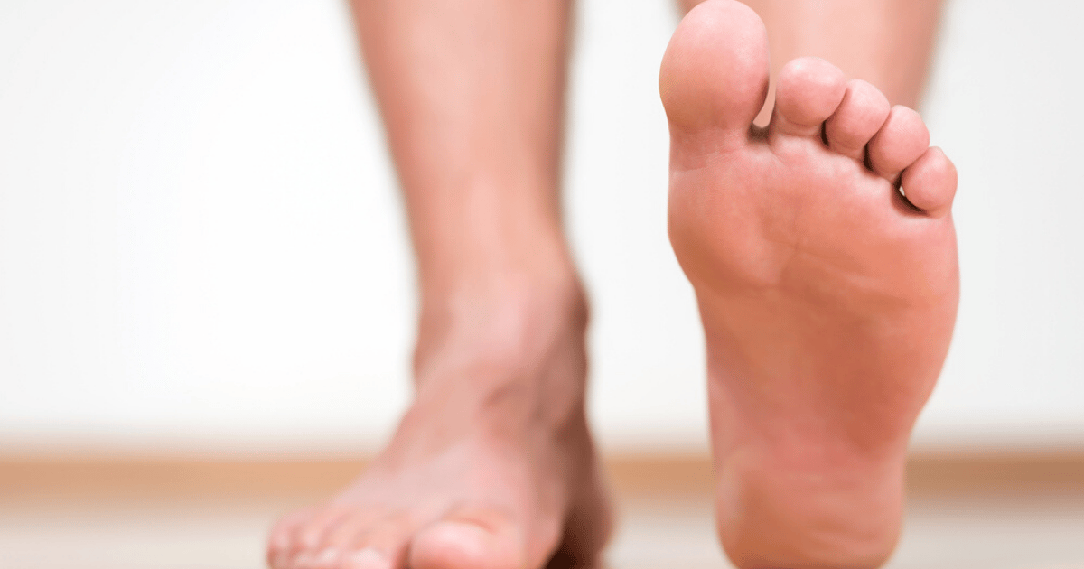 Foot lifted off the floor of person who successfully finished athletes foot treatment by being consistent 