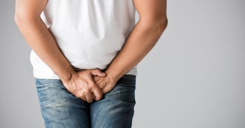 Man standing unconfortable because jock itch wont go away